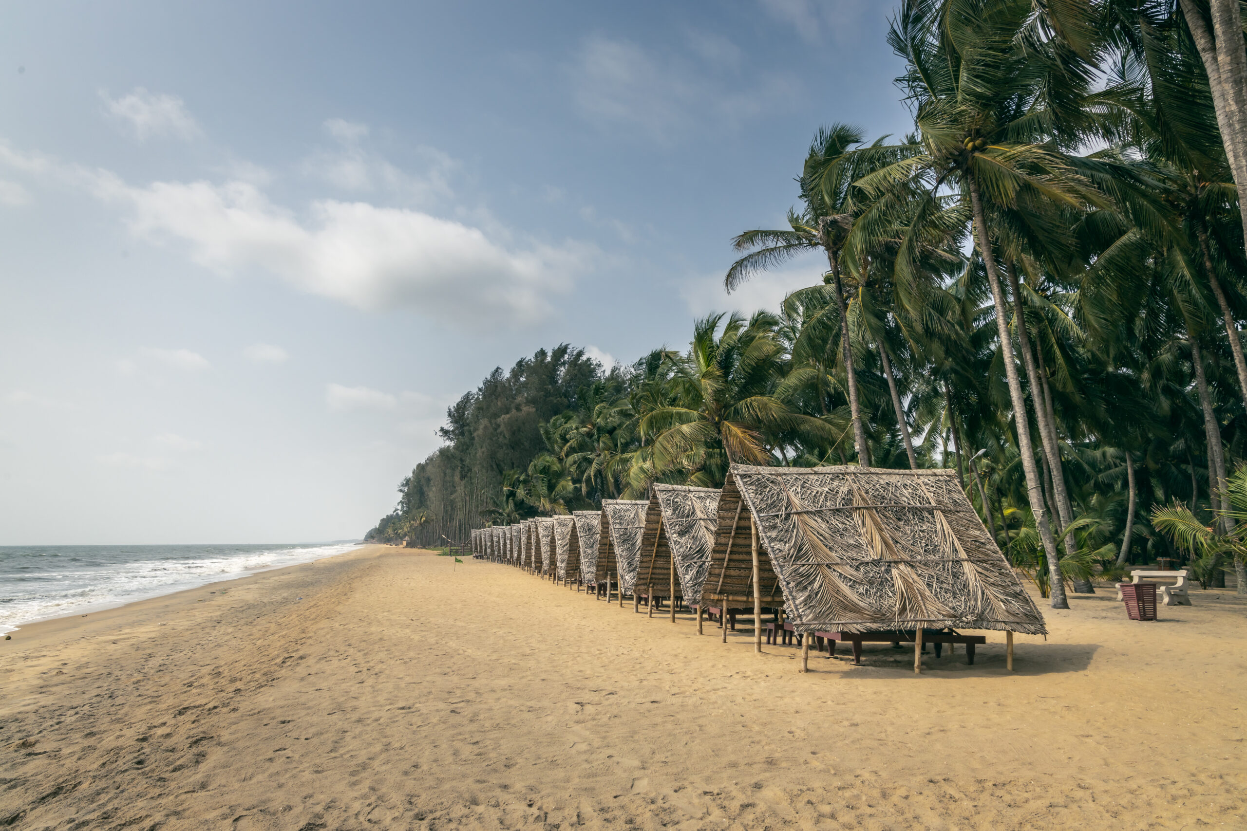 Beach with huts from South side June 2025_The Nattika Beach Ayurveda Resort